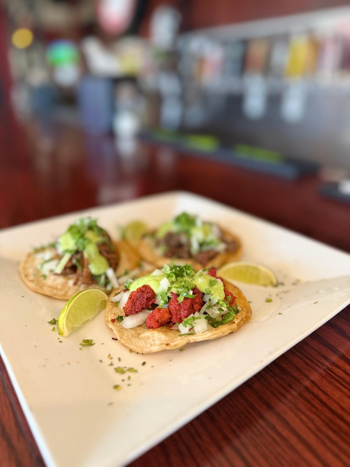 Street tacos with avocado salsa and lime at the Westrail bar
