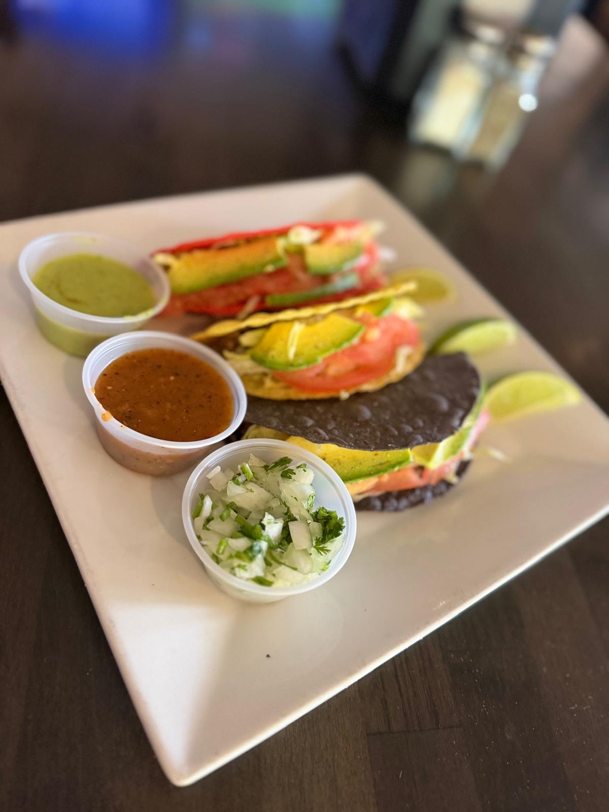 Veggie tacos with avocado tomato and three house salsas at Westrail