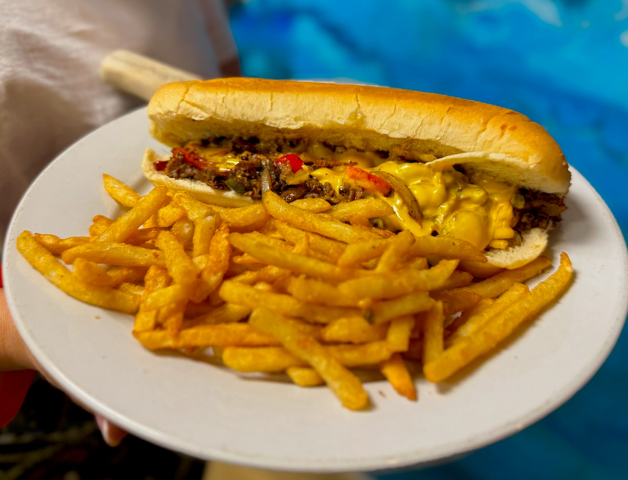 Cheesesteak sandwich with fries at Westrail Tap and Tequila